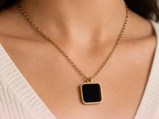 Elysian Black pendant stainless steel anti tarnish gold tone square black pendant on pink background